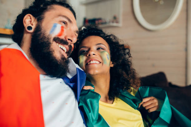 istock Couple watching soccer game on TV 952796758