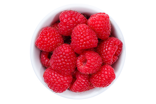 Raspberries berries from above bowl isolated on a white background