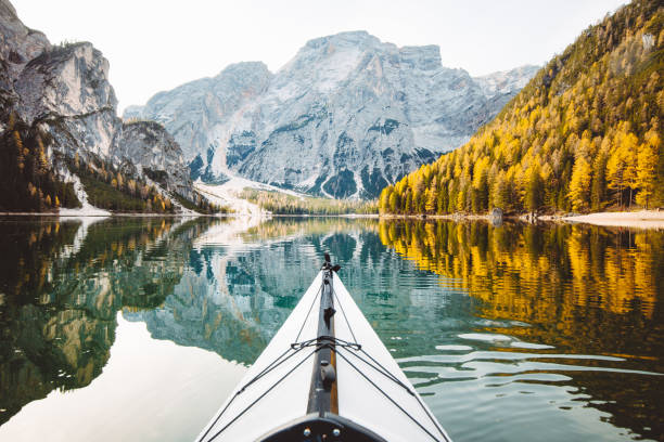 Kayak on a lake with mountains in the Alps