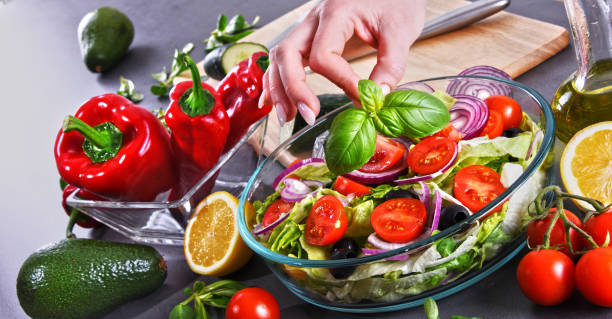 istock Preparation of a vegetable salad from fresh organic ingredients 952820418
