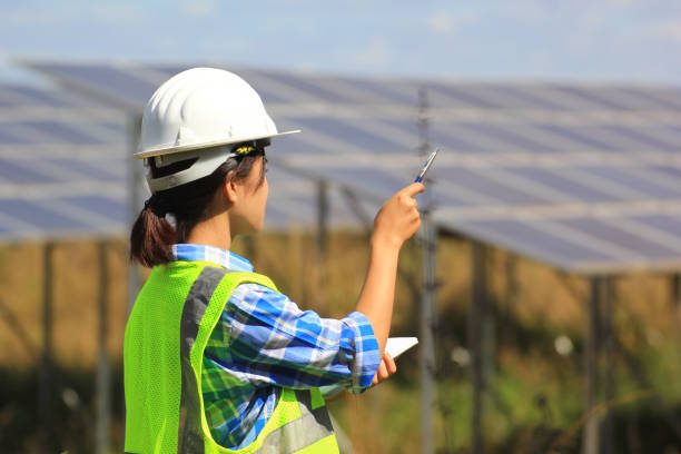istock young woman engineer checking solar panel at solar power plant 952822144