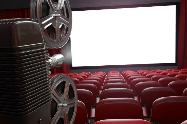 Photo of Movie projector and blank cinema screen with empty seats. Cinema, movie or home video concept background.