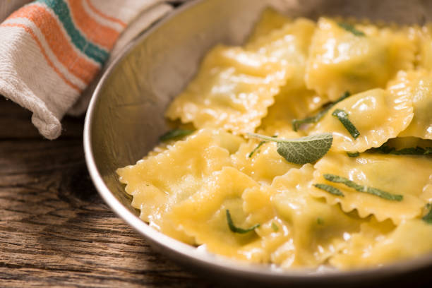 istock Italian cuisine: ravioli pasta with parmesan cheese and sage 952831248