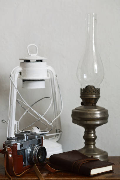 istock vintage stuff. Photo camera, lights, leather note pad on white background 952836024