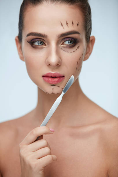 istock Plastic Surgery Operation. Beautiful Woman With Lines On Face 952843076