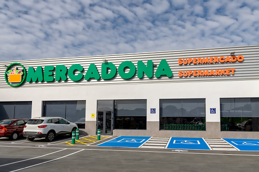 View of entrance and parking lot of Mercadona supermarket in Punta Umbria, Huelva, Spain.