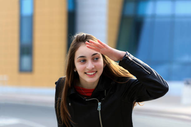 istock Happy young girl on the sreet, looking for something 952851980