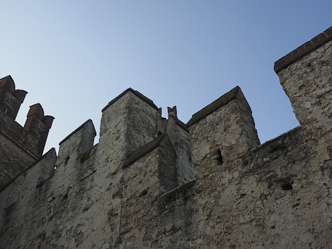 Sirmione, Italy - April 25, 2018: The Scaliger Castle of Sirmione is a fortress of the Scaligeri era. Access door to the historic center of Sirmione. It is one of the most complete castles in Italy, as well as a rare example of lacustrine fortification