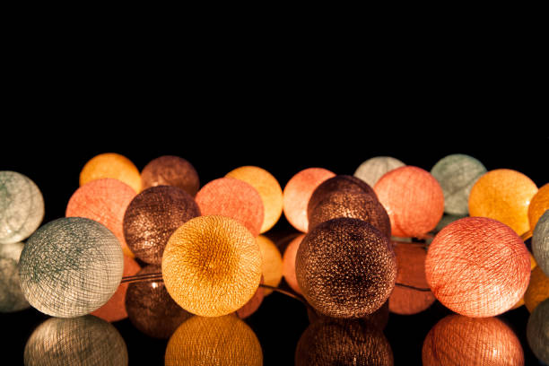 colorful glowing balls on a black background. glowing garland at night. colorful circles on the background. - lamp lighting equipment light reading imagens e fotografias de stock