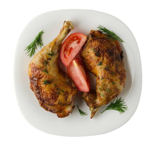 istock Chicken thigh with vegetables  isolated on white background 952861992