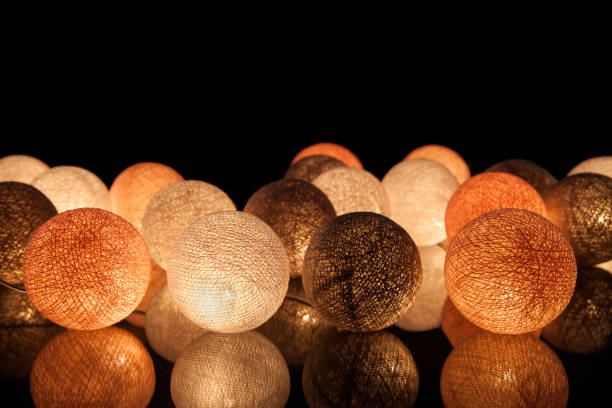 colorful glowing balls on a black background. glowing garland at night. colorful circles on the background. - lamp lighting equipment light reading imagens e fotografias de stock