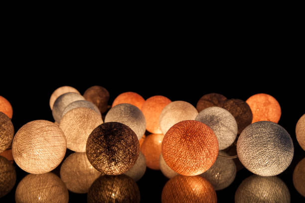 colorful glowing balls on a black background. glowing garland at night. colorful circles on the background. - lamp lighting equipment light reading imagens e fotografias de stock