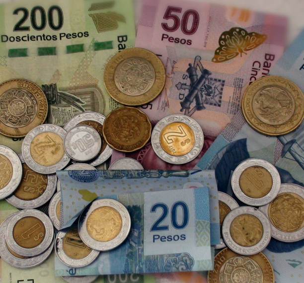 istock Mexican Currency Notes And Coins Scene In Cancun. Mexico 952865794
