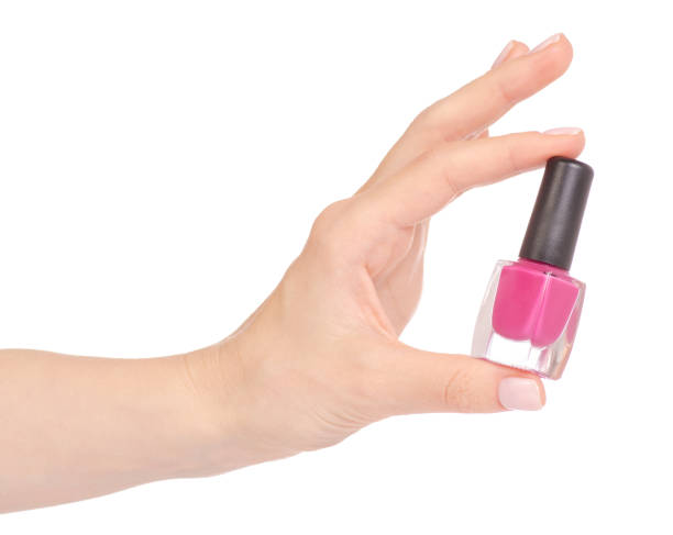 istock Pink nail polish in hand 952877658