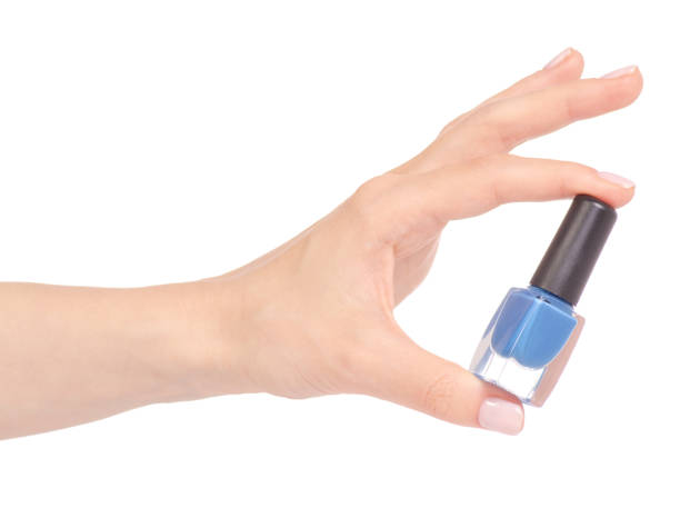 istock Blue nail polish in hand 952877666