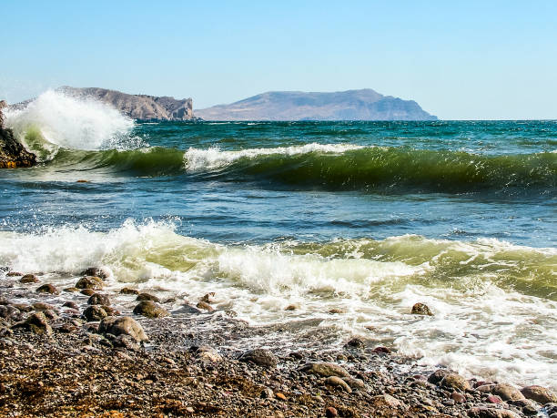 Wild bay on the Black Sea coast in the eastern Crimea near the village of Sudak. Storm, waves