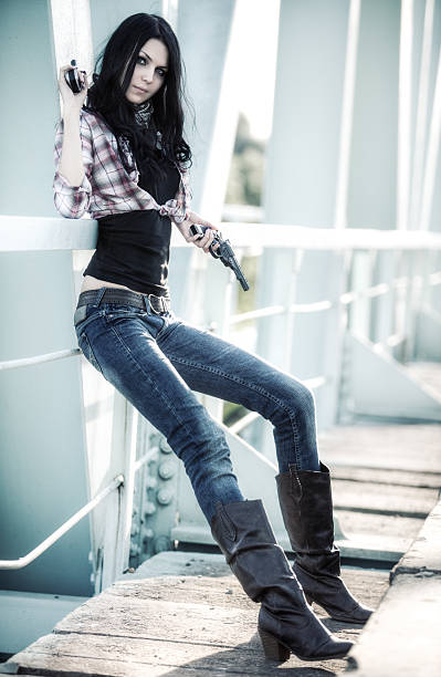 istock Young slim woman with guns 95287880