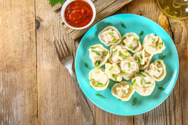 istock Homemade ready dumplings on an old wooden table. 952892432