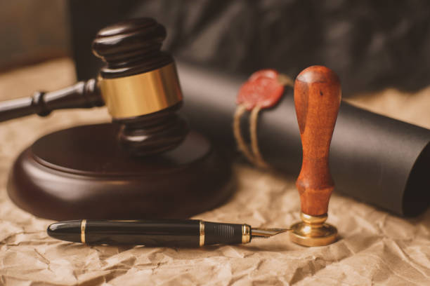 istock Fountain pen and old notarial wax seal on document, closeup 952894104