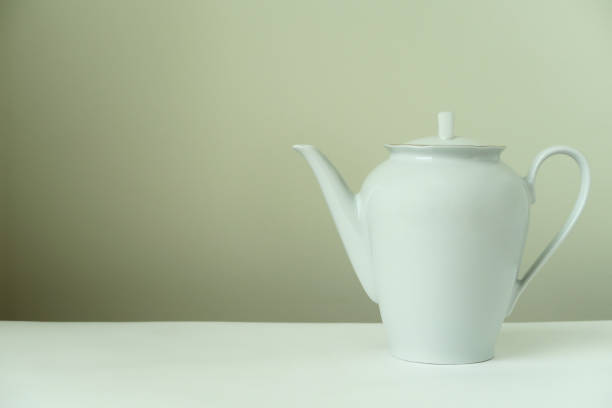 istock white porcelain teapot on a light background 952907958