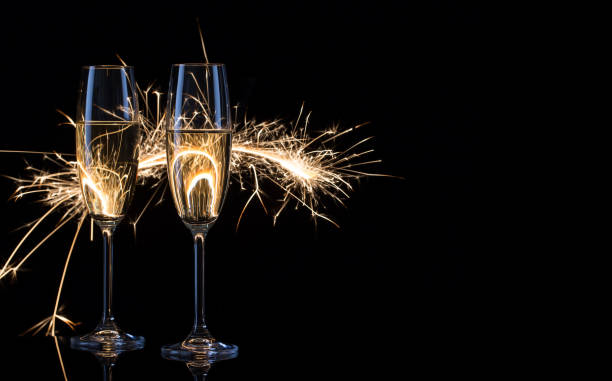 istock Two glasses of champagne in Bengal lights 952910080