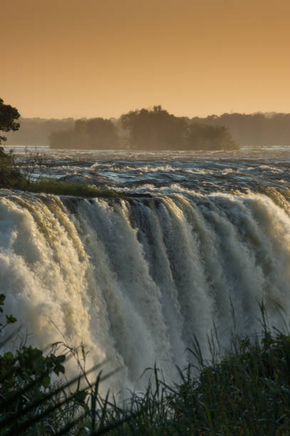 istock Victoria Falls at sunrise Orange 952918146