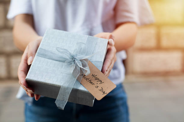istock Woman holding mothers day gift 952924002