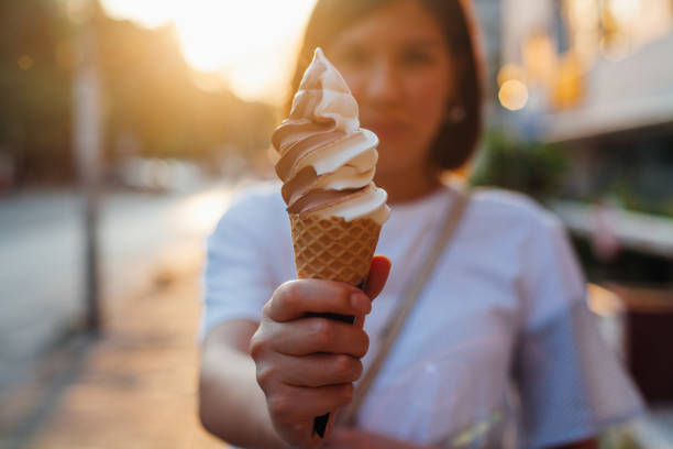 istock Woman eating ice cream 952924432