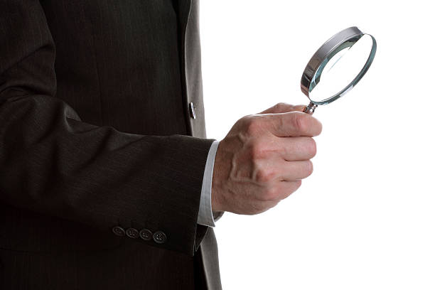 istock Businessman with magnifying glass 95292976