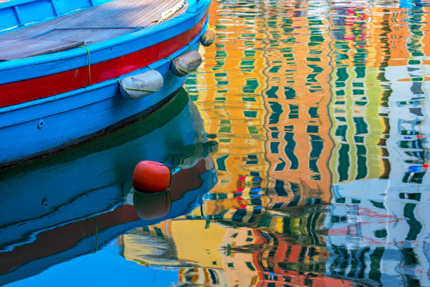 istock Boat and coloeful reflection on the water. 952931778