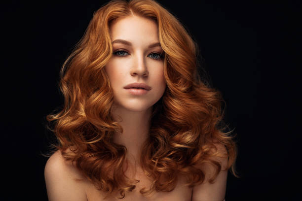 istock Red haired woman with curly hairstyle 952935186