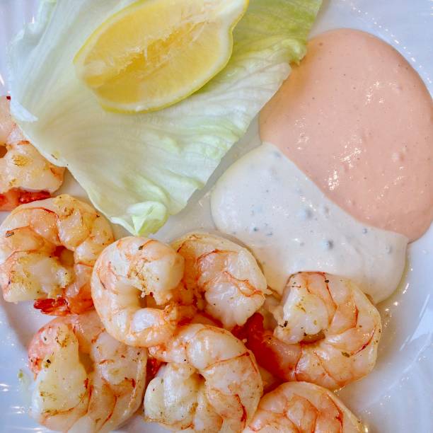 istock Gourmet shrimp with dip sauce and salad 952943148