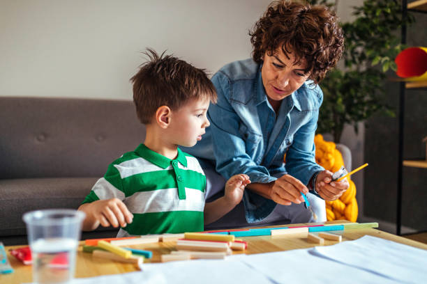 istock Mother and son coloring together 952944064