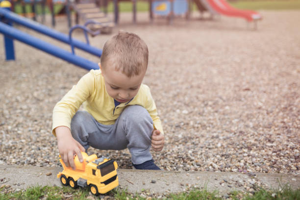 istock Adorable little boy having fun on playground 952947186
