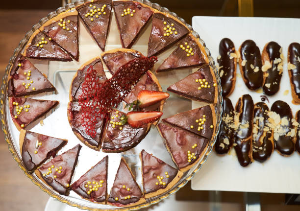 istock Chocolate cake with strawberry and chocolate eclairs 952947234
