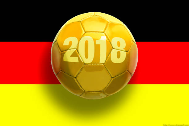 istock Golden soccer ball on flags background. 952950210