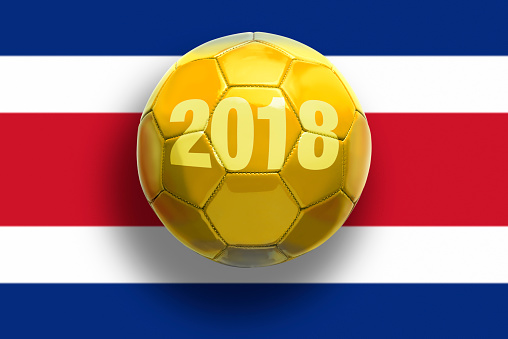 Golden soccer ball on flags background..
