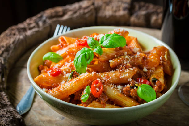 istock Delicious penne bolognese with red wine and parmesan 952958038