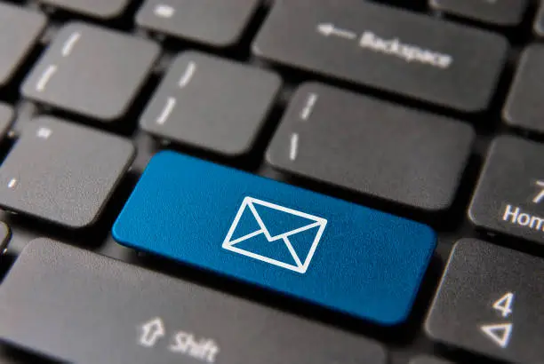 Photo of Email computer button for business contact mail