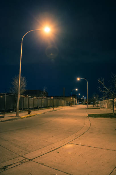 istock Dark and empty city road street at night 952961646