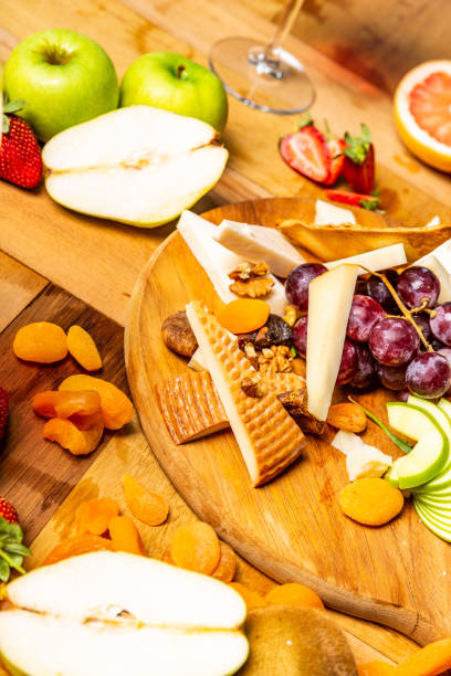 istock Cheese board with fruits and wine 952962560