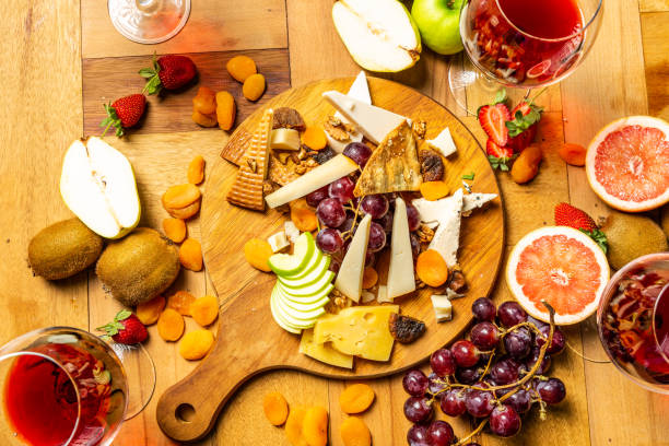 istock Cheese board with fruits and wine 952962574