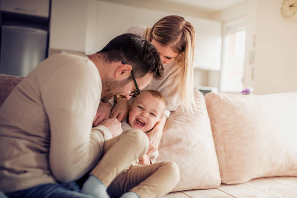 istock Happy young family enjoying at home 952964986