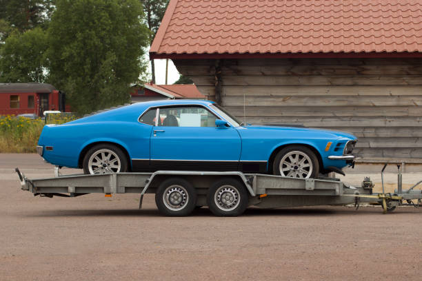 Car on a flatbed truck. Auto carrier trailer.