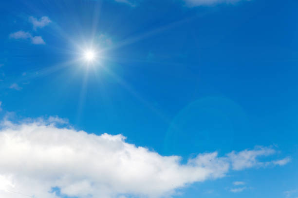 istock clouds against a blue sky with rays of the sun 952970094