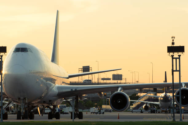 istock Airport airliner at dusk departure with control tower 952970894