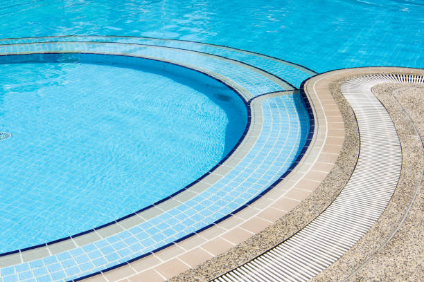 istock Swimming pool with stair at hotel close up. 952980974