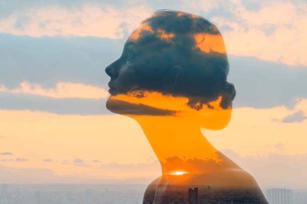 Double exposure of woman face and sunset glow. Double exposure of woman face and sunset glow. dawn of new era stock pictures, royalty-free photos & images