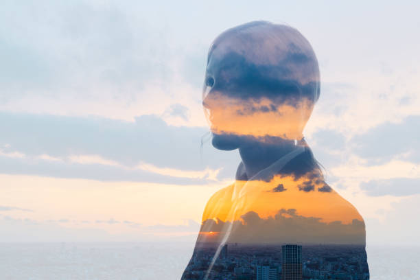 Double exposure of woman face and sunset glow. Double exposure of woman face and sunset glow. sunrise timelapse stock pictures, royalty-free photos & images