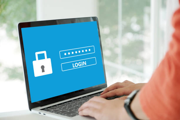 istock Hand tying laptop computer with password login on screen, cyber security concept 952984972